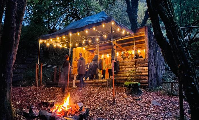 Secluded woodland log cabin for relaxing as a team, sharing a glass of bubbly and toasting marshmallows. There is no better way to wrap up a day spent